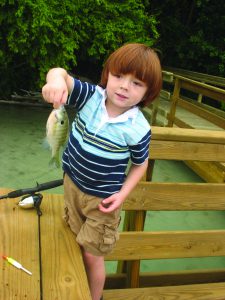 Boy Holding Fish