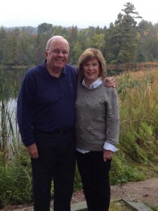 Jim and Beverly Duff with the protected land behind them