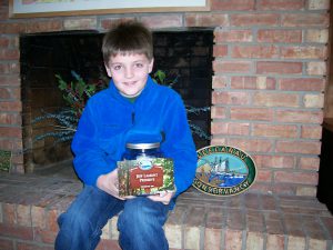 Jeff Lamont’s cousins, including 10-year-old Phil Later, collected coins to help offset the cost of the sign for the new preserve.