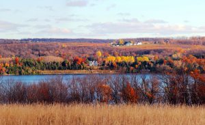 At Clay Cliffs Natural Area, views of fall leaves along both Lake Leelanau and Lake Michigan give visitors a quintessentially Leelanau experience. Photo by Trish Petrat.