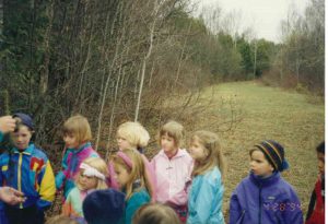 Ellen Posner, in blue coat, second from right, on an Earth Day tree planting outing. 